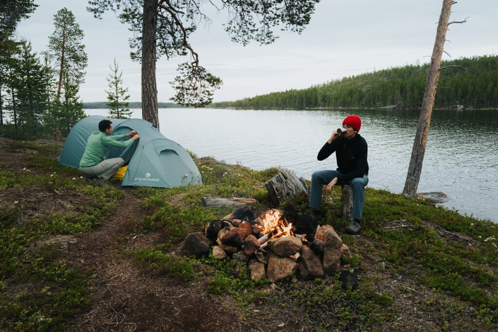 two guys camping river side