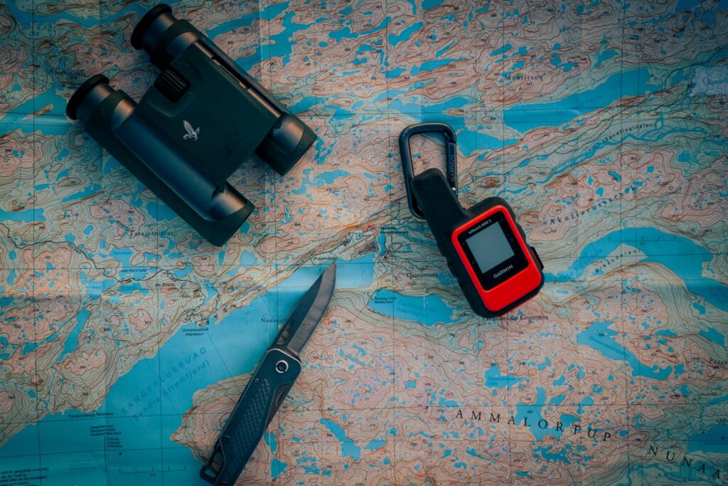 a map, binoculars, gps and a knife