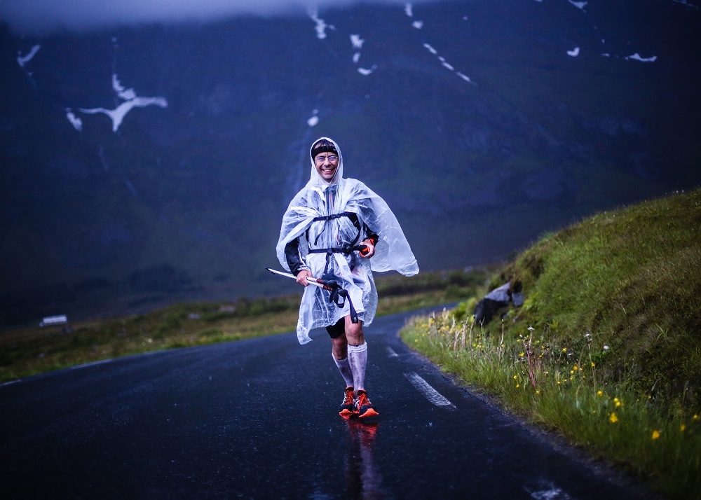 man running in a rain on a dark day 1000x714