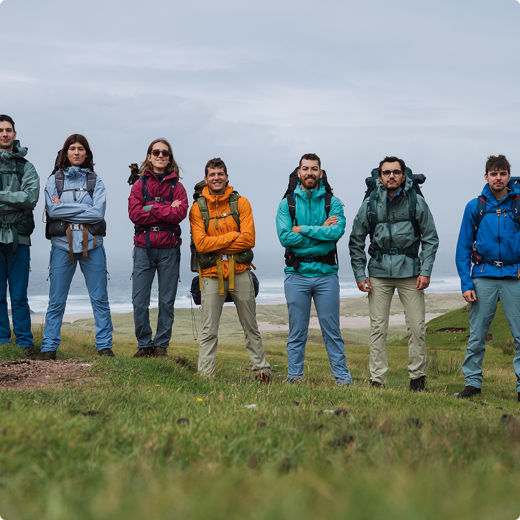People In Row Prepared For A Long Hike