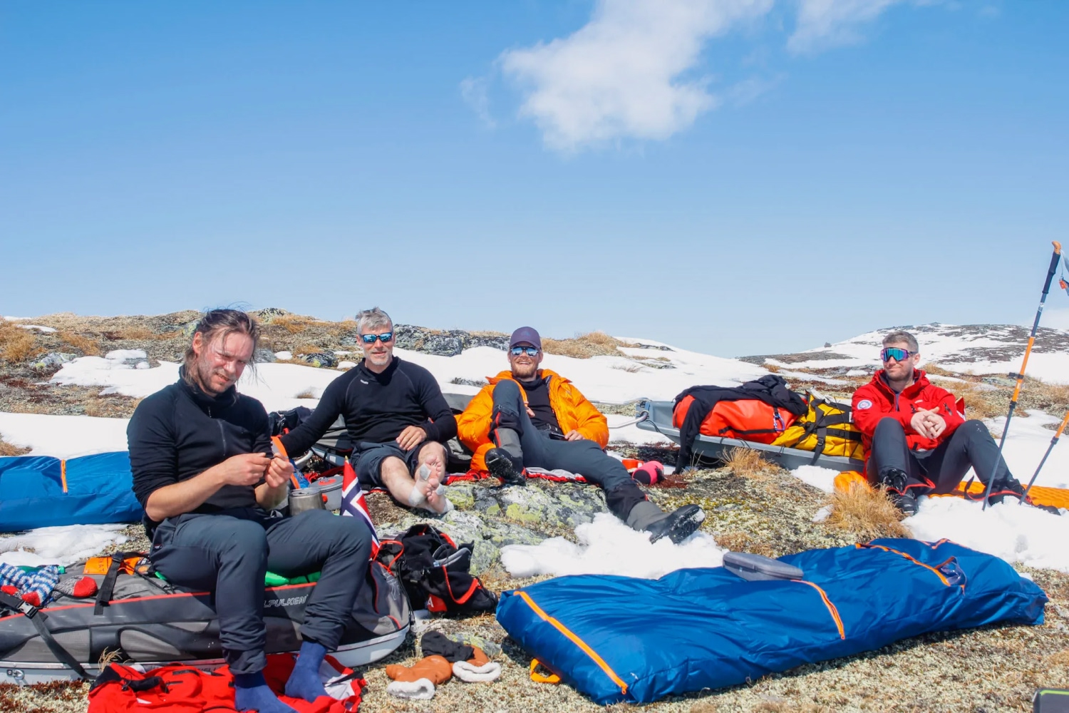 people sitting together in the snow